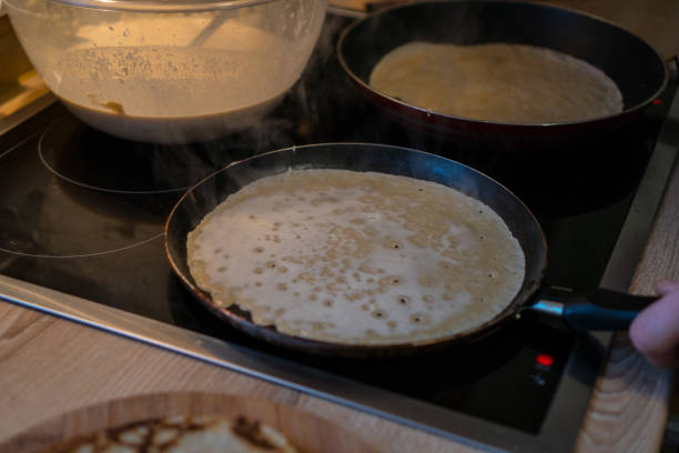 istock prepares pancakes in the kitchen 912726796