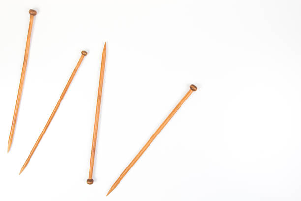 istock Wooden knitting needles on white background as frame 912726830