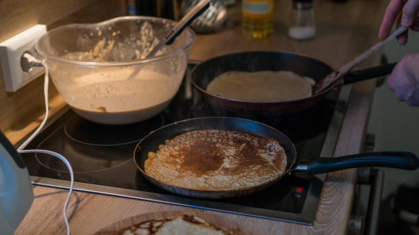 istock prepares pancakes in the kitchen 912726852
