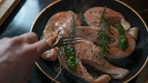 istock raw salmon with rosemary and lemon for lunch 912727490