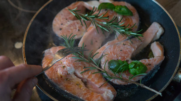 istock raw salmon with rosemary and lemon for lunch 912727582