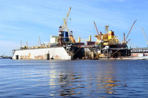istock ship are being fixed and painted at the shipyard docks 912728332