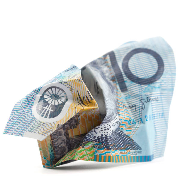 Ten Australian Dollar Bill - Crumpled Crumpled Australian ten dollar bill on white background. australian dollar stock pictures, royalty-free photos & images