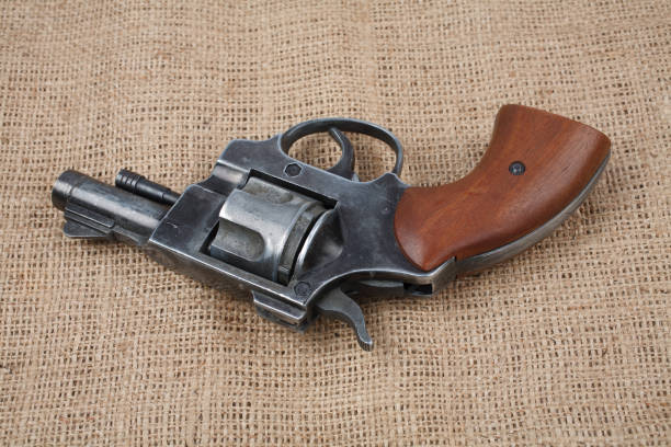 istock Revolver on the canvas background 912733898