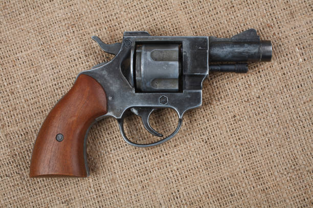 istock Revolver on the canvas background 912733956