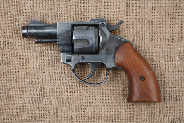 istock Revolver on the canvas background 912734176