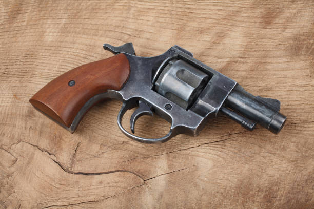 istock Revolver on the wooden table 912734228