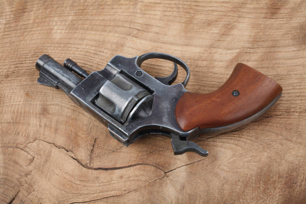 istock Revolver on the wooden table 912734268