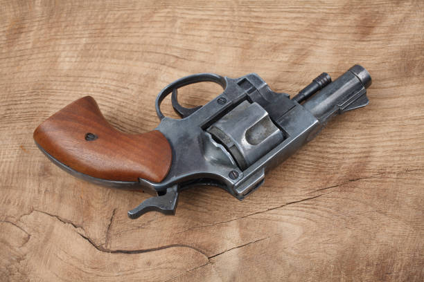istock Revolver on the wooden table 912734316