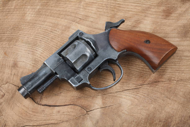 istock Revolver on the wooden table 912734350