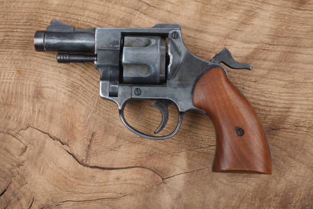 istock Revolver on the wooden table 912734402