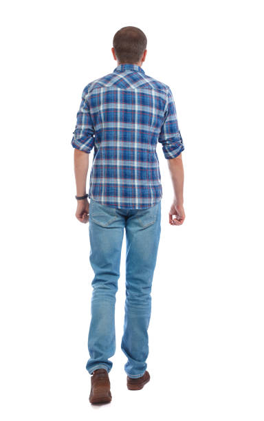 istock Back view of going  handsome man. walking young guy . 912734508