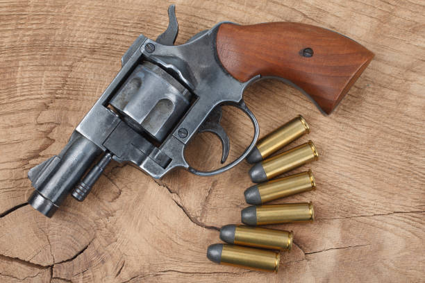 istock Revolver with ammunition on the wooden table 912734622