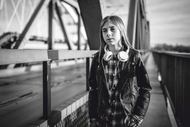 istock A girl walking across the bridge 912735144