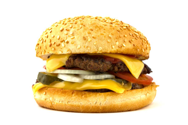 istock Burger close-up isolated on white background. Big burger with beef cutlet, tomato, cheese, pickled cucumbers and onions on a white background. 912735798