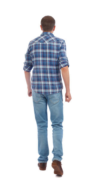istock Back view of going  handsome man. walking young guy . 912737982
