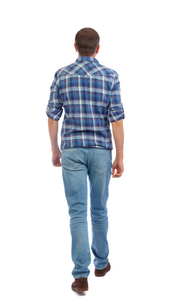 istock Back view of going  handsome man. walking young guy . 912738158