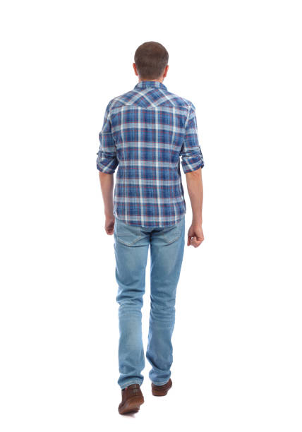 istock Back view of going  handsome man. walking young guy . 912738436