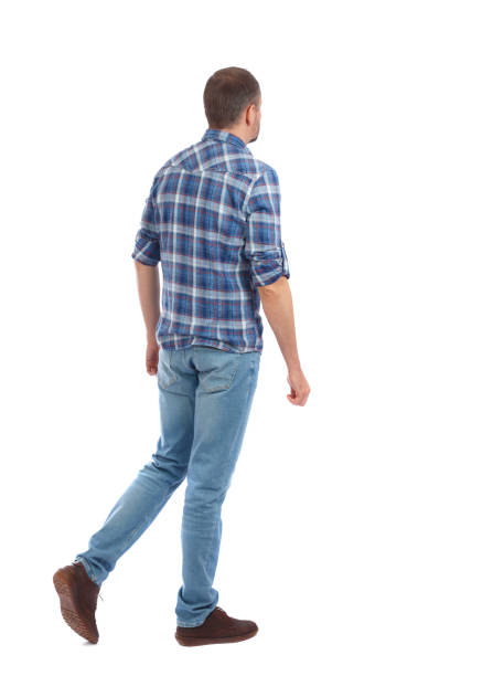 istock Back view of going  handsome man. walking young guy . 912738816