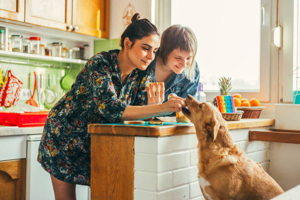 Two females enjoing breakfast at home stock photo