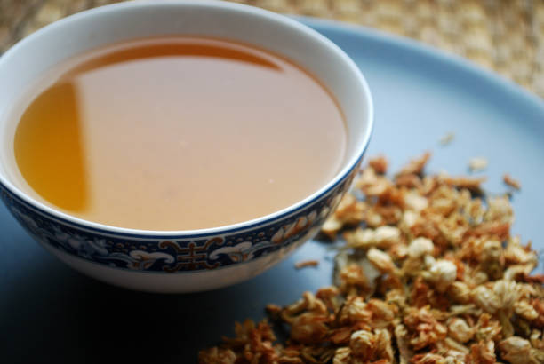 istock Bowl of jasmine tea with dried flower buds. 912742076