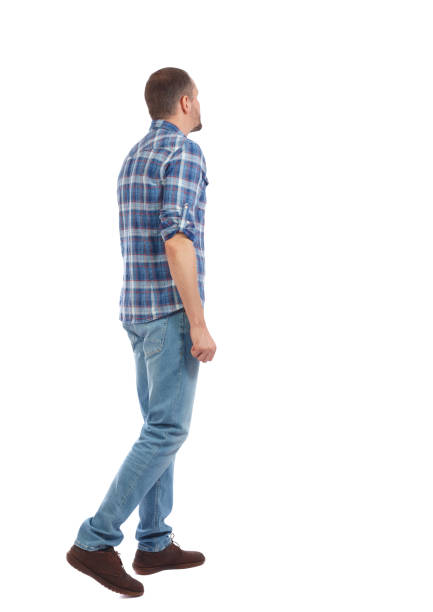 istock Back view of going  handsome man. walking young guy . 912742108