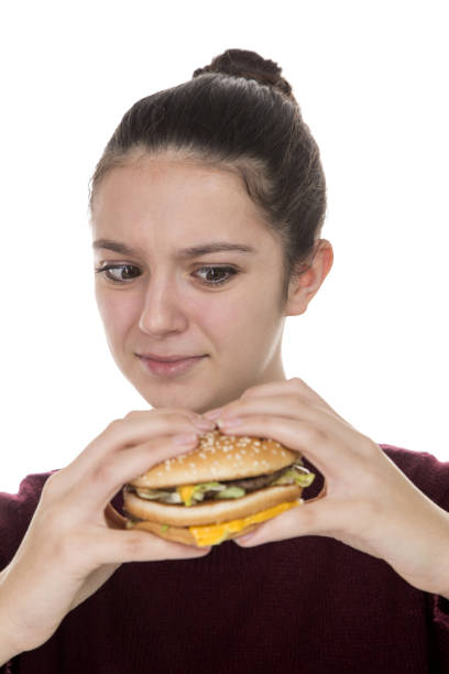 istock Adolescent girl and hamburger 912744770