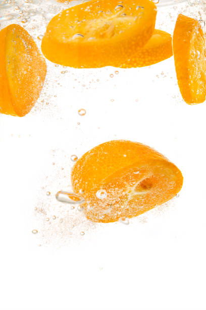 istock Orange slices into water with bubbles 912745222
