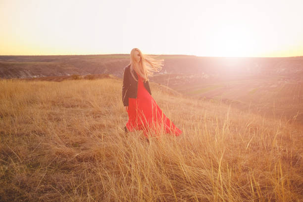 istock Girl in red dress 912745262