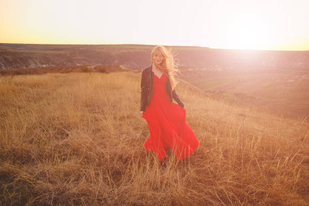istock Girl in red dress 912745310