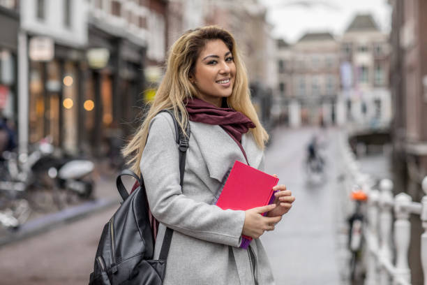 istock Beautiful female university student studying outdoors in delft city centre 912752128