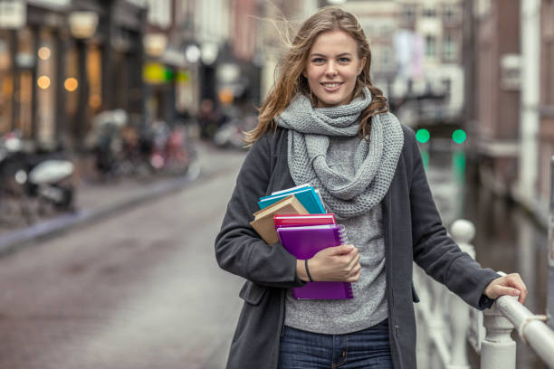 istock Beautiful female university student studying outdoors in delft city centre 912752162
