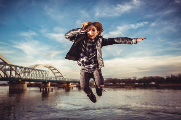 istock Happy girl jumping 912752512