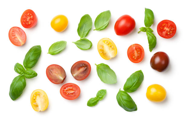 istock Tomatoes and Basil Leaves Isolated on White Background 912757940