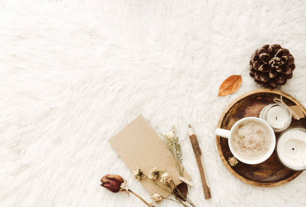 istock Coffee cup with candles in cozy home atmosphere. Flat lay with copy space 912758262