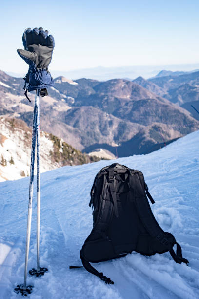 istock Ski Poles, Gloves and Backpack on a Viewpoint on Ski Slope 912766092