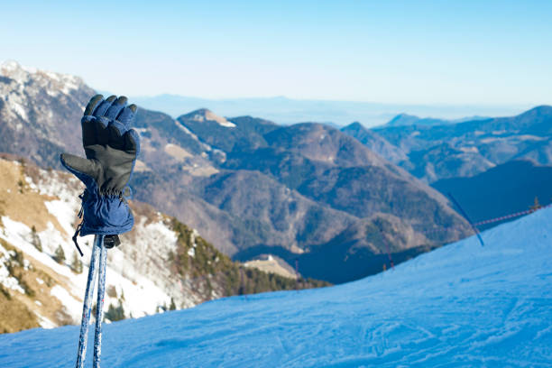 istock Skiing Gloves and Ski Poles on a Viewpoint on Ski Slope 912766100