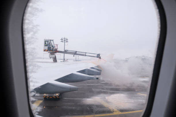 A de-icing unit sprays the wing of a commercial aircraft on a cold winter day in Munich, Germany. (February 1, 2011)