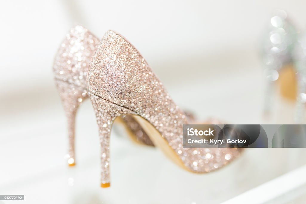 Beautiful Golden Glitter High Heel Female Shoes On Glass Shelf Wedding  Accessories Cinderella Shoes Selective Focus Stock Photo - Download Image  Now - iStock