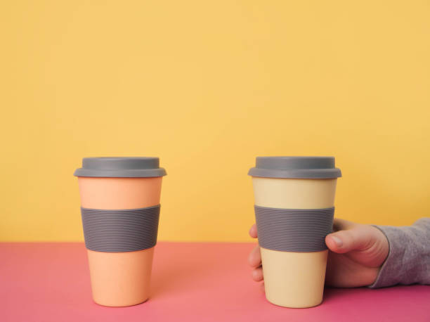 istock Take away coffee cups on colorful paper background 912773398