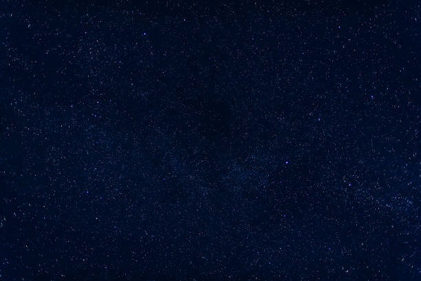 istock dark blue night sky with milky way and nebulae 912778178