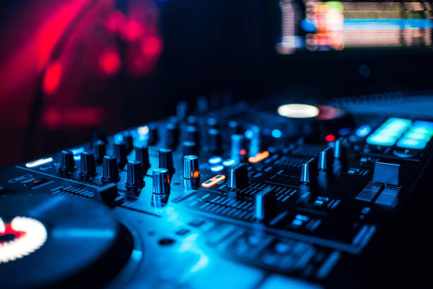 istock control buttons and mixing music on professional equipment for mixing DJ 912779514