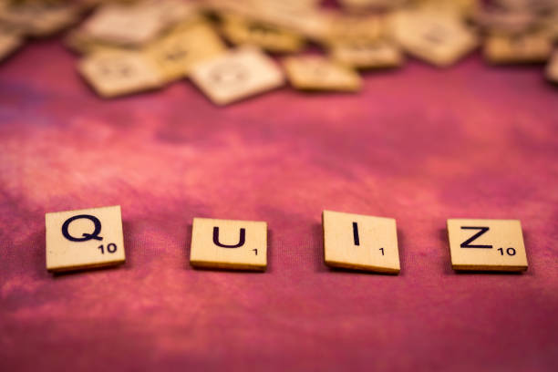 istock Quiz - Alphabet wooden letters Concepts 912785692