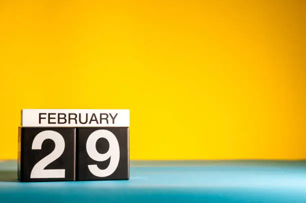 February 29th. Day 29 of february month, calendar on yellow background. Winter time, leap-year. Empty space for text.