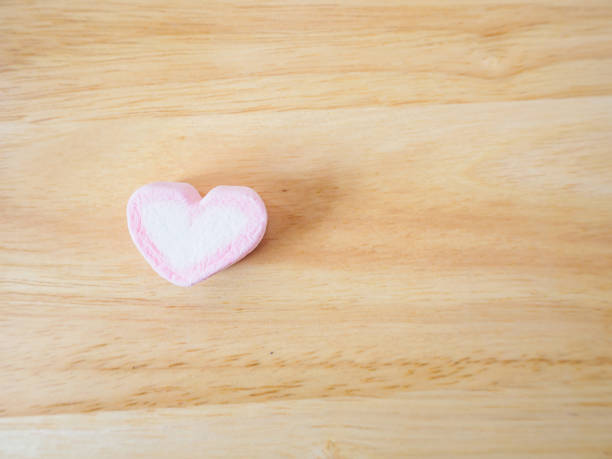 istock pink heart shape marshmallow for valentines background 912802880