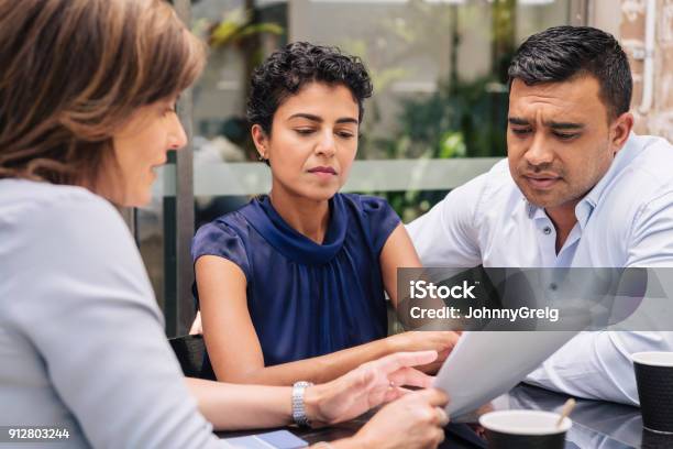 Serious Couple Receive Professional Advice Stock Photo - Download Image Now - Legal System, Customer, Advice