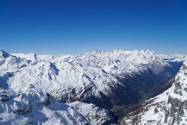 istock High mountains under snow in the winter 912811582