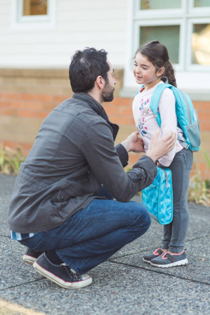 istock Dad drops his little girl off at school 912812470