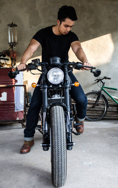 istock young man sitting on cafe racer motocycle 912812888