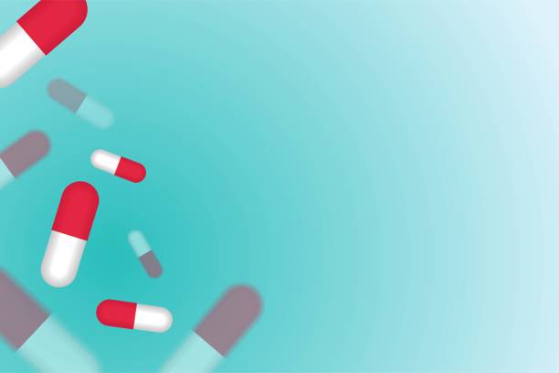 istock Fly out red pills medication concept isolated in soft blue color background 912819406
